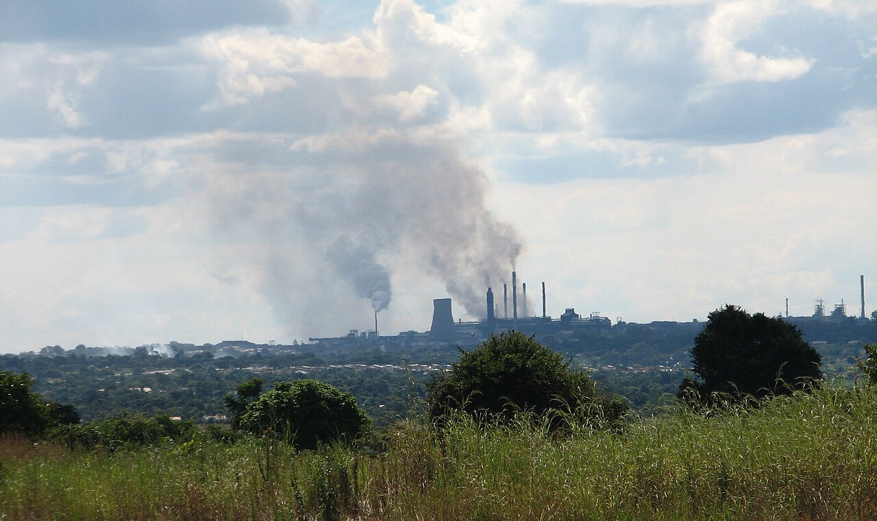 Smoke rising from industrial chimneys on the edge of Kitwe, Zambia
